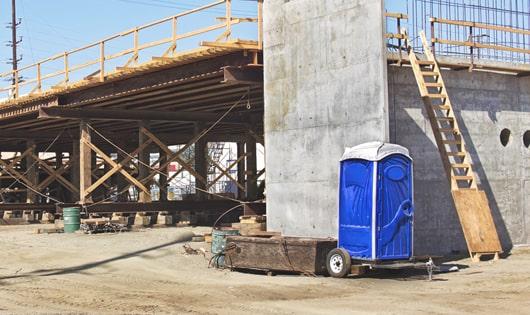 construction site necessities a group of porta potties ready for use by the crew